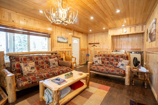 living room with wood ceiling, an inviting chandelier, wooden walls, and dark hardwood / wood-style floors