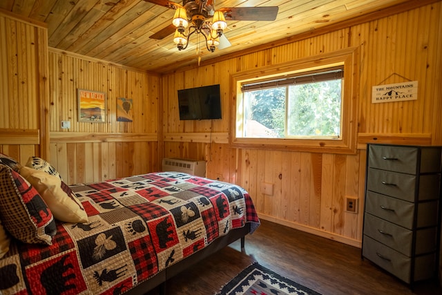 bedroom with an AC wall unit, dark wood-type flooring, wood ceiling, and wood walls