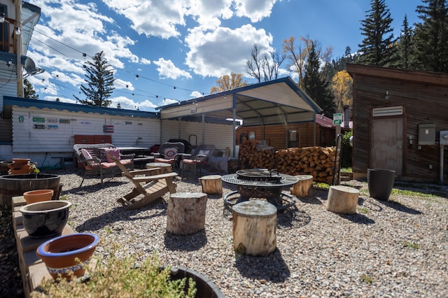 view of yard with an outdoor fire pit