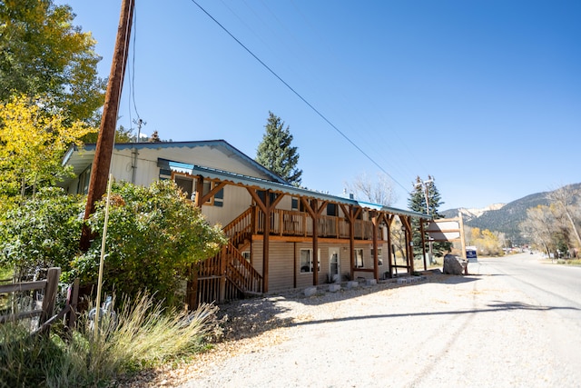 exterior space featuring a mountain view