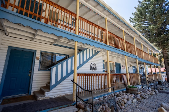 entrance to property with a balcony