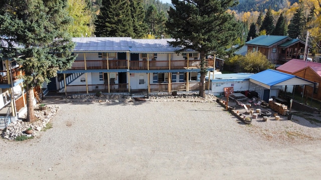 view of front of home featuring a balcony