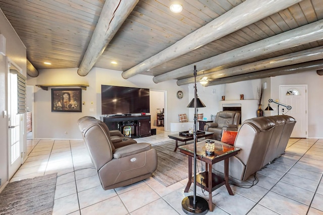 tiled living room featuring beam ceiling, wood ceiling, and a fireplace