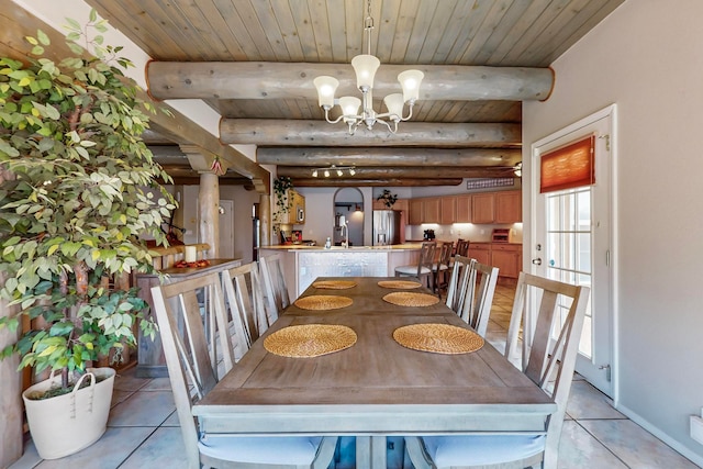 dining room featuring beamed ceiling, a chandelier, light tile patterned flooring, and wood ceiling