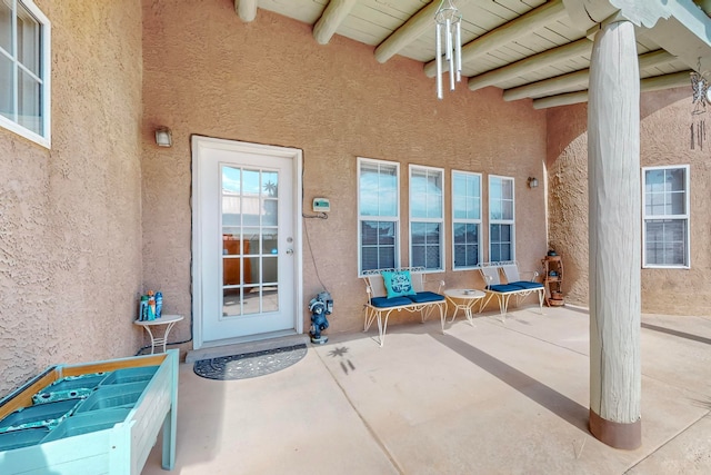 doorway to property featuring a patio