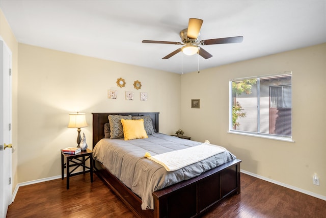 bedroom with dark wood-type flooring and ceiling fan