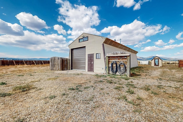 view of outbuilding featuring a mountain view