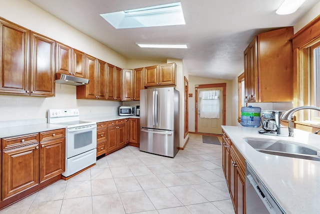 401A Nm-344, Edgewood, NM 87015 - kitchen with under cabinet range hood, light countertops, a sink, and appliances with stainless steel finishes