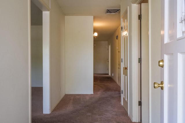 corridor with dark colored carpet