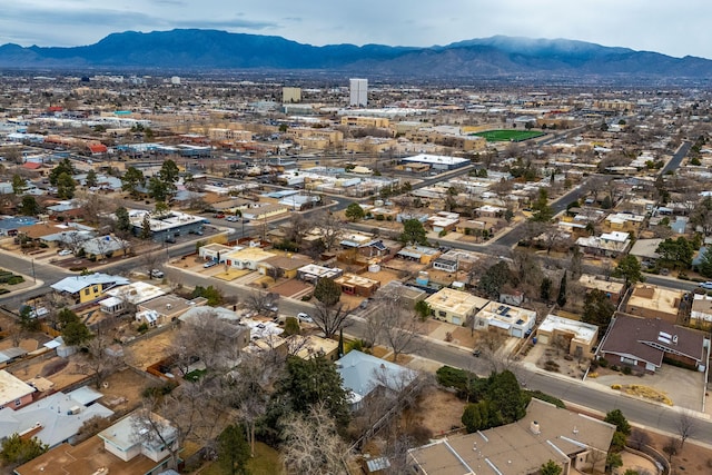 birds eye view of property with a mountain view