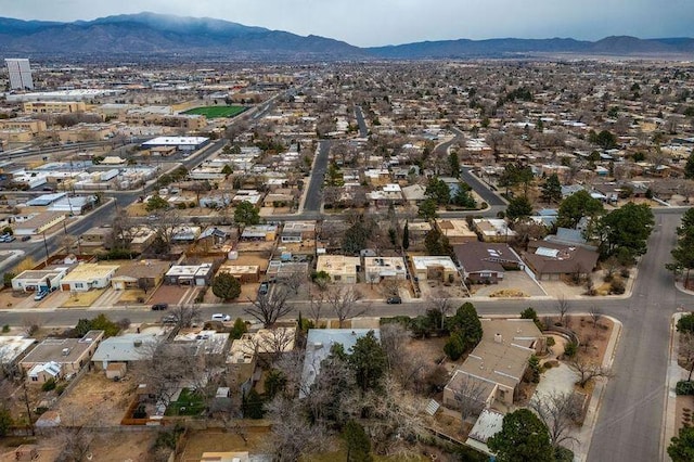 birds eye view of property featuring a mountain view