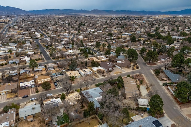 birds eye view of property with a mountain view