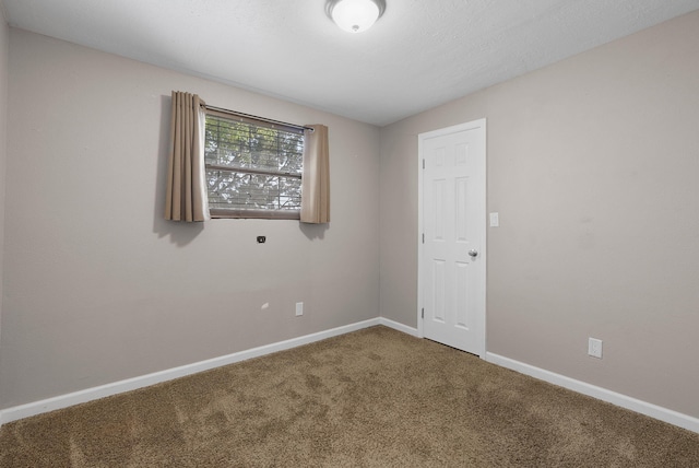 unfurnished room with carpet floors