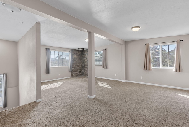 basement with carpet floors and a textured ceiling