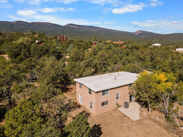 birds eye view of property with a mountain view