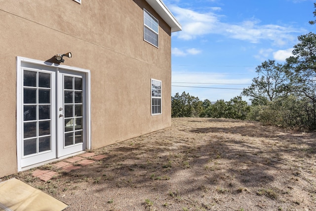 view of property exterior with french doors