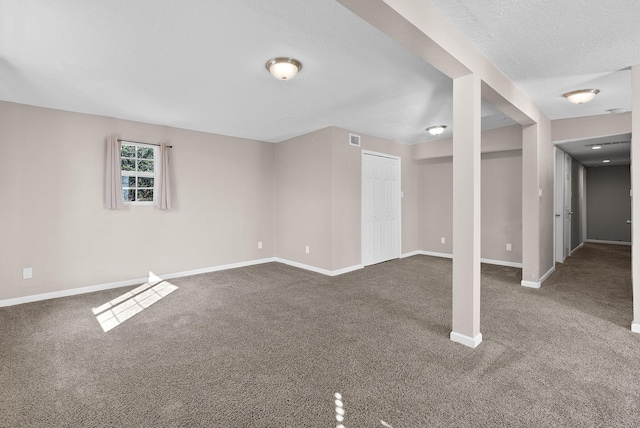 interior space with carpet flooring and a textured ceiling