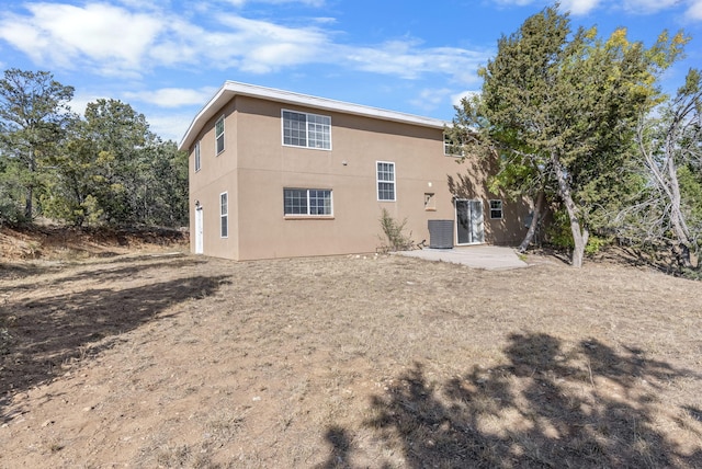 rear view of house featuring a patio area and central air condition unit