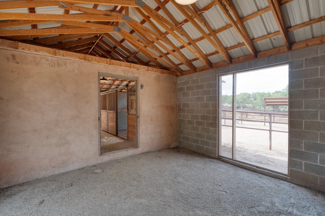 interior space featuring lofted ceiling with beams