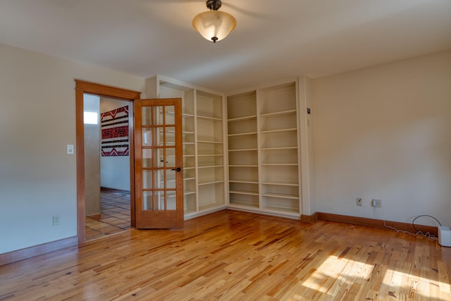 spare room with light wood-type flooring