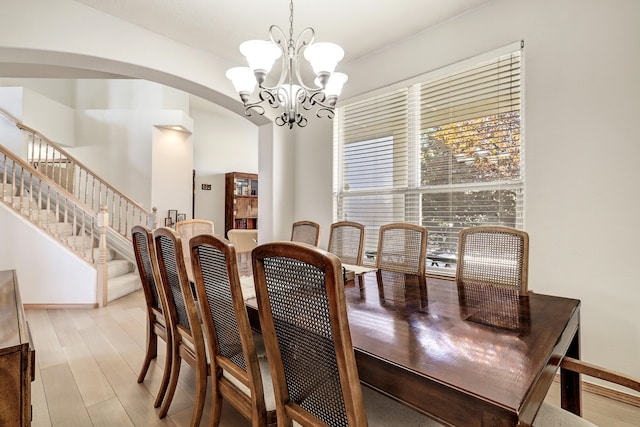 dining room featuring light hardwood / wood-style floors and a chandelier