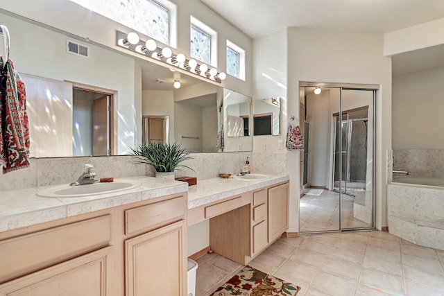 bathroom with vanity, plus walk in shower, and tile patterned floors