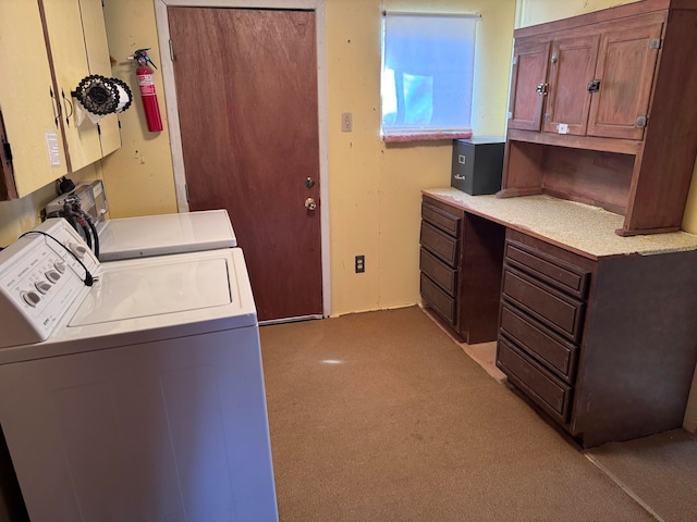 laundry room with cabinets and washer and dryer