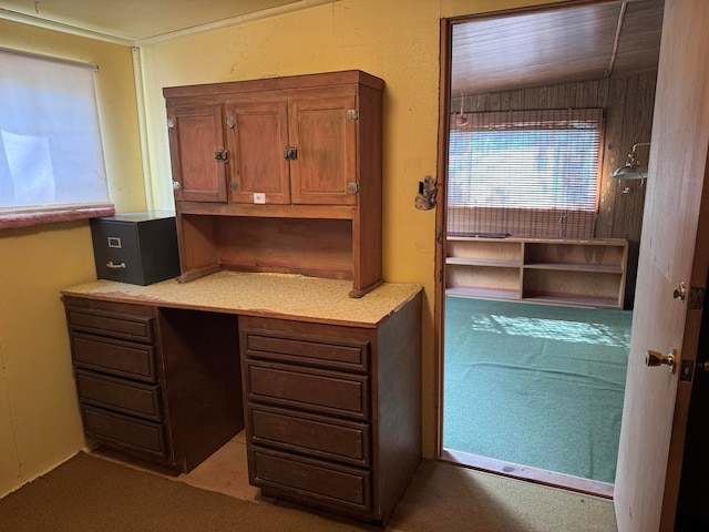 office area with carpet and vaulted ceiling