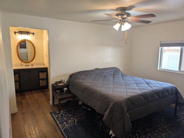 bedroom featuring ensuite bath, hardwood / wood-style floors, and ceiling fan