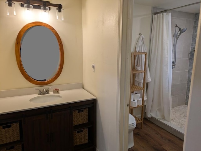 bathroom with vanity, toilet, a shower with curtain, and hardwood / wood-style floors