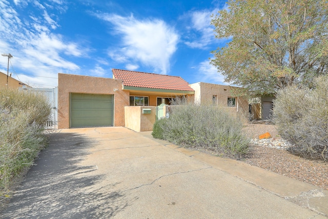 southwest-style home featuring a garage