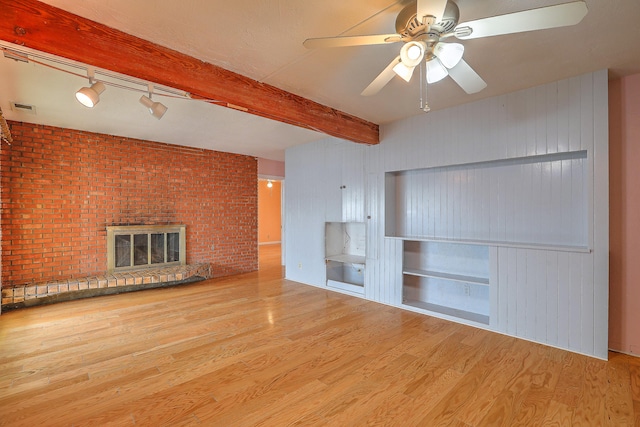 unfurnished bedroom with a closet, light hardwood / wood-style flooring, a spacious closet, and ceiling fan