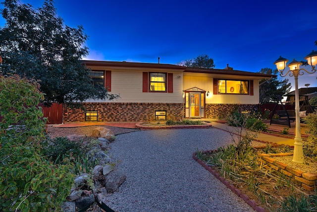 split foyer home featuring a patio area