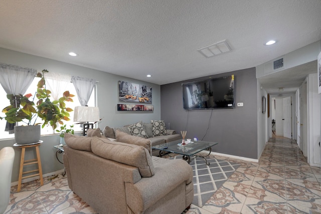 living room featuring a textured ceiling