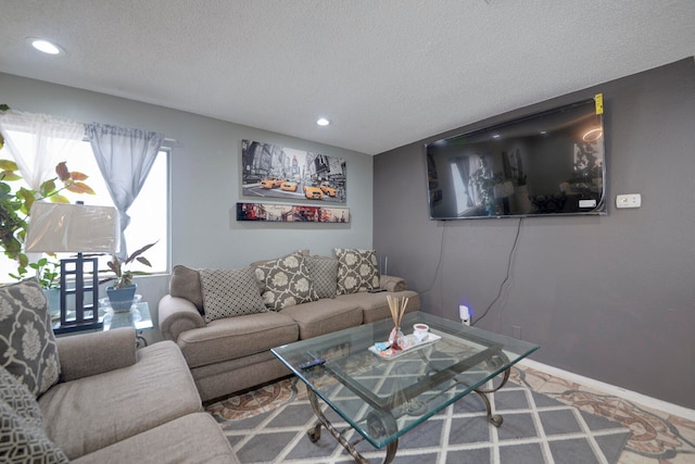 living room featuring a textured ceiling