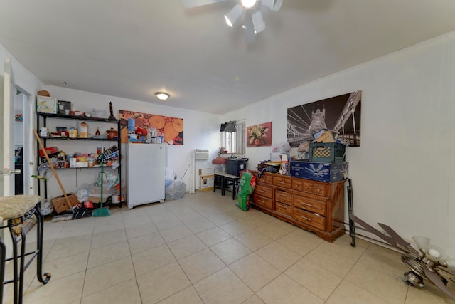 interior space with ceiling fan and light tile patterned floors