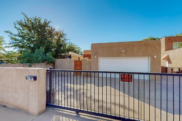 view of gate featuring a garage