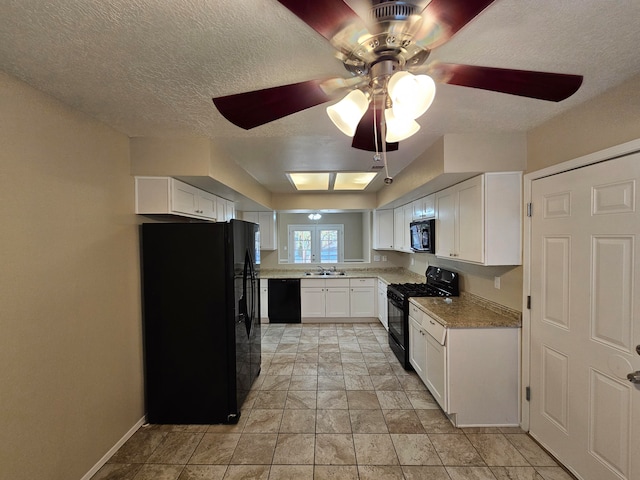 kitchen featuring sink, black appliances, white cabinetry, a textured ceiling, and ceiling fan