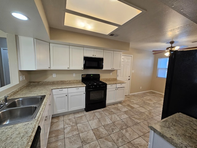 kitchen featuring ceiling fan, a textured ceiling, white cabinetry, black appliances, and sink