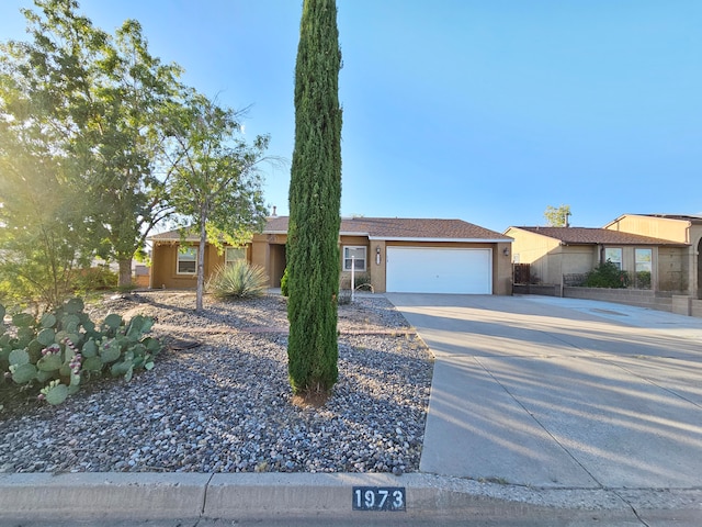 single story home with a garage