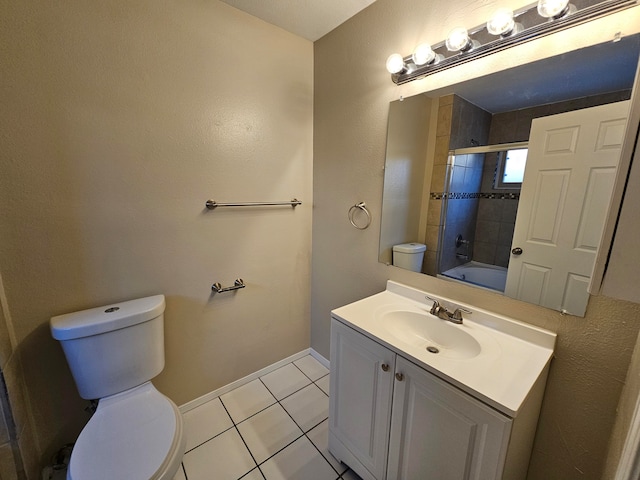 full bathroom with toilet, tiled shower / bath combo, vanity, and tile patterned flooring