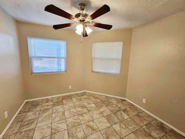 spare room featuring ceiling fan and a textured ceiling