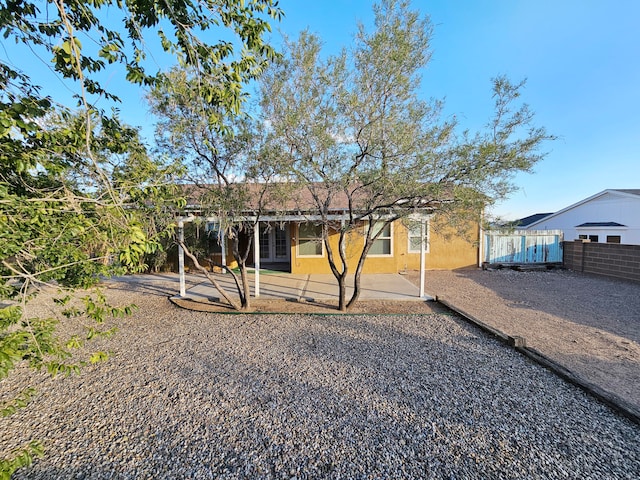 rear view of property featuring a patio area