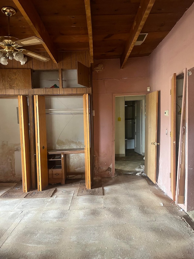 miscellaneous room with beam ceiling and ceiling fan