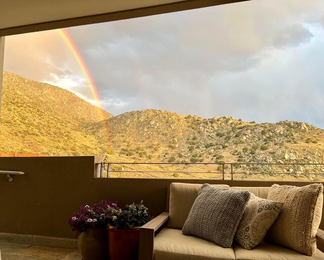 balcony featuring a mountain view