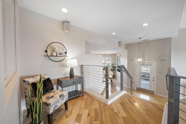 interior space featuring light hardwood / wood-style flooring and a chandelier