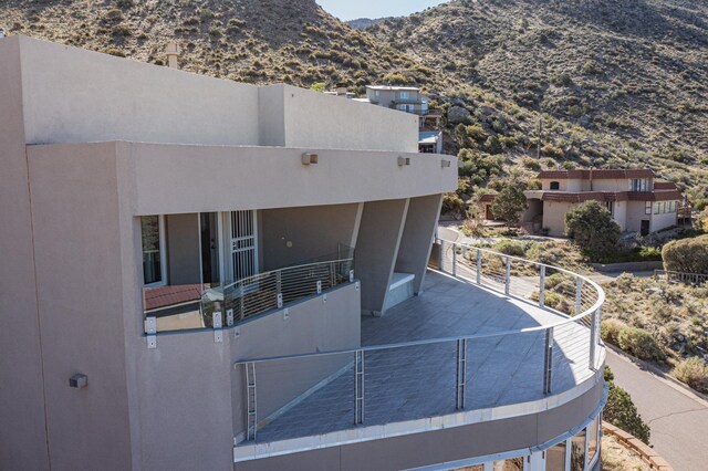 exterior space with a mountain view and a balcony