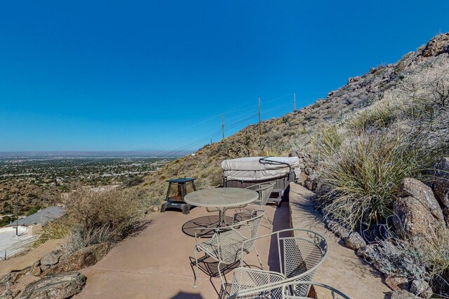 view of patio / terrace with a mountain view