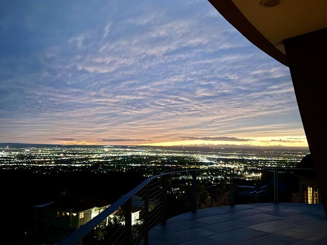 view of balcony at dusk