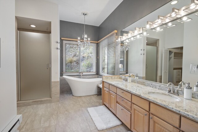 bathroom with vanity, plus walk in shower, an inviting chandelier, a baseboard heating unit, and tile patterned flooring